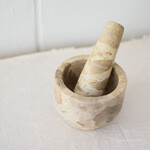 Mortar and pestle in beige