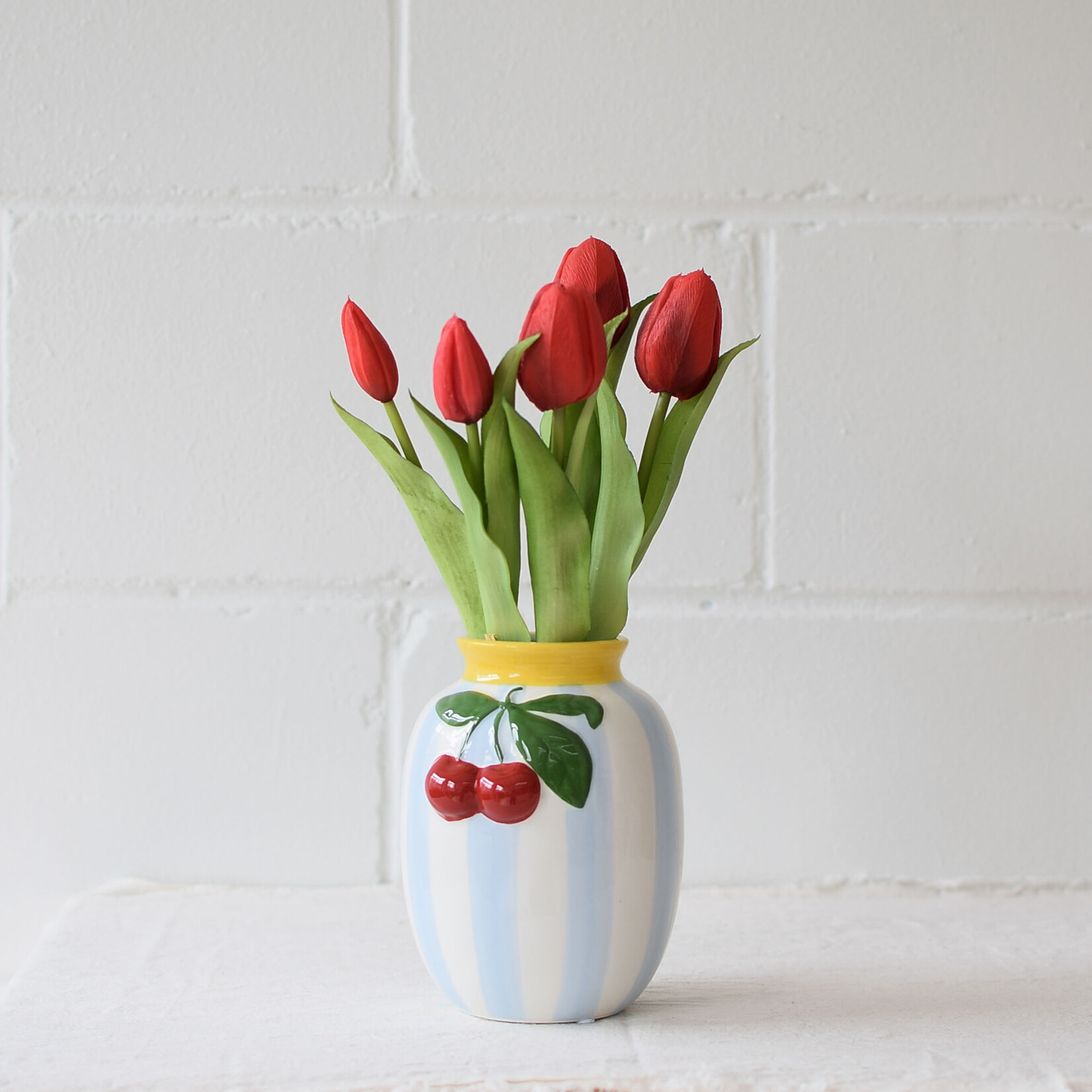 Vase with blue stripes and cherries