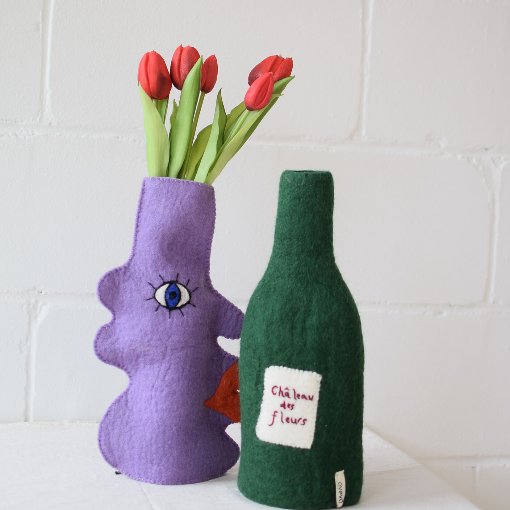 Couvre bouteille en laine Visage - Lilas