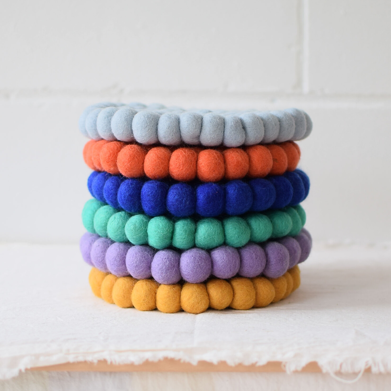 Dessous de plat pompons uni - Lilas