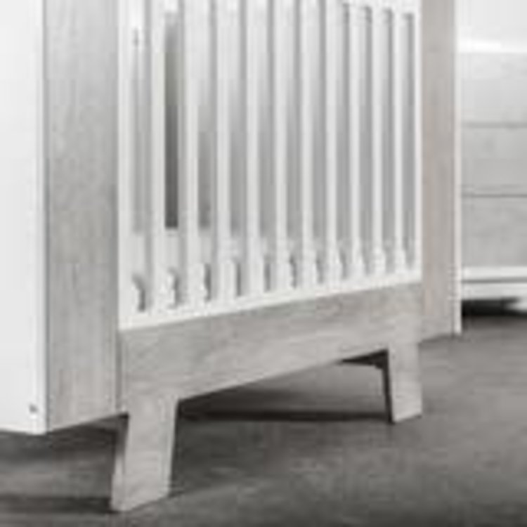 white and wood crib