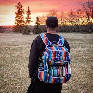 Person wearing a disc golf backpack