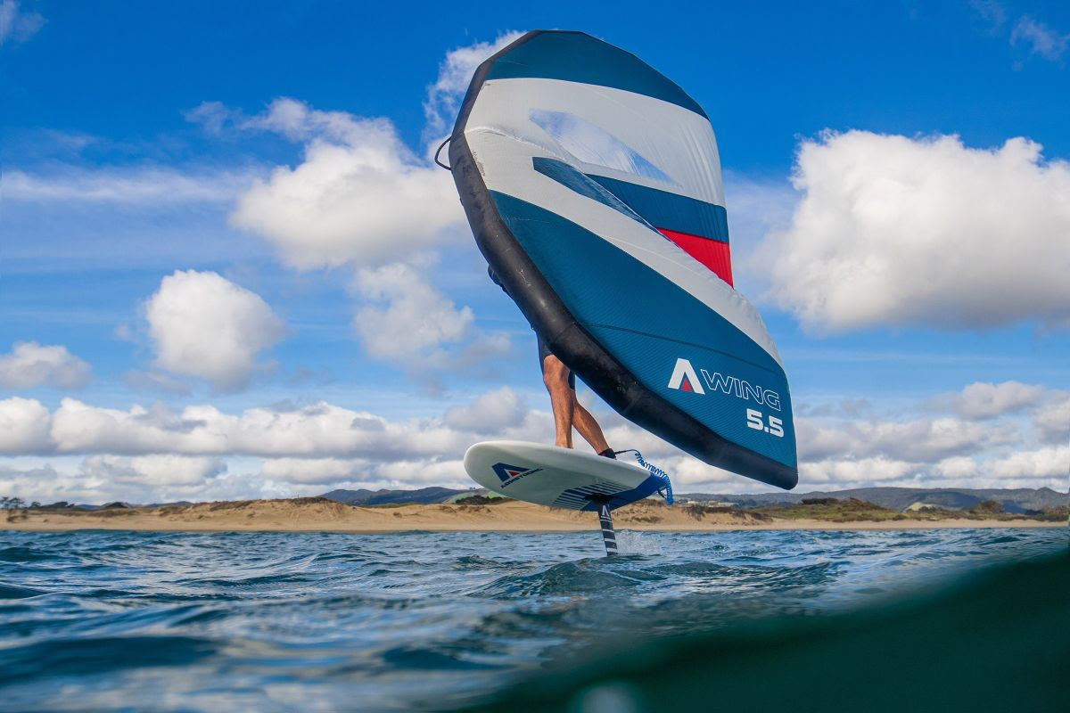 Man windfoiling + windsurfing in saskatchewan