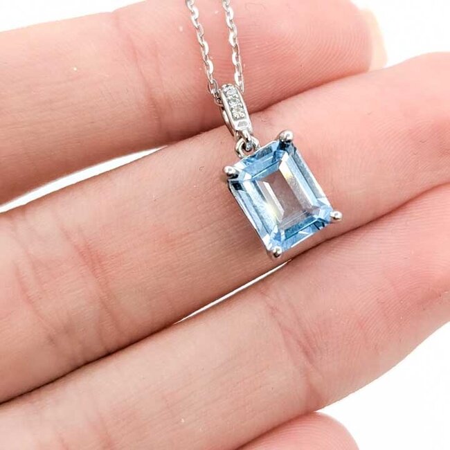 Pendant Accented .04ctw Round Diamonds 3ct Sky Blue Topaz 14kw .75x.3" 16-22" Adjustable 3.63g 125100013