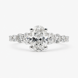 Ring Graduated 1.01ct Oval Lab Grown Diamond IGI Report: 756503774 VVS2 E .90ctw Round Diamonds 14kw 2mm Sz7 2.1g 125060061