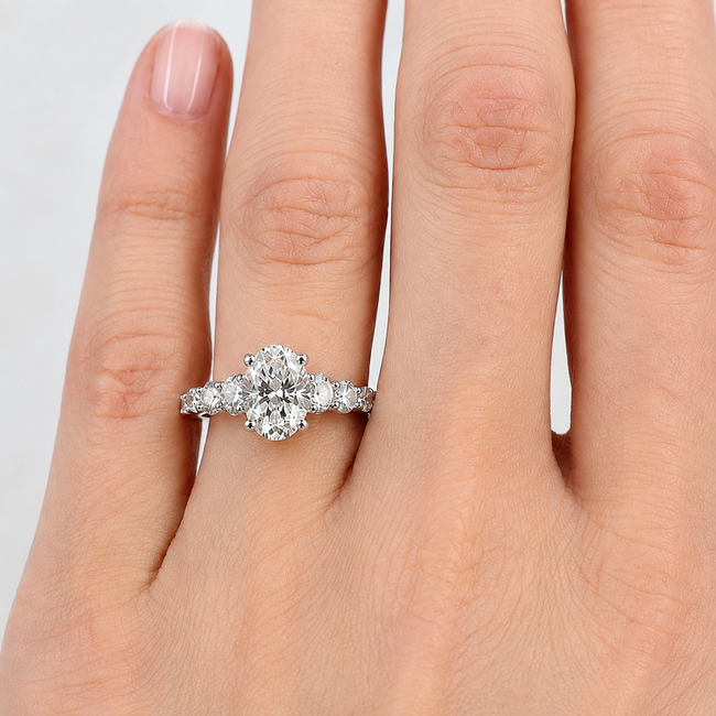 Ring Graduated 1.01ct Oval Lab Grown Diamond IGI Report: 756503774 VVS2 E .90ctw Round Diamonds 14kw 2mm Sz7 2.1g 125060061