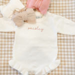 Levi and Lane Newborn White Ruffle Knit Romper