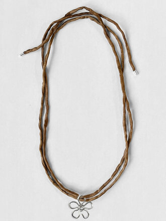 Kara Yoo Flora Pendant on raw silk cord . Sterling silver and moka