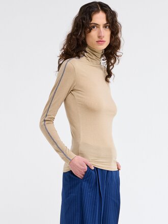 Our Sister Lewis fitted turtleneck top . Tan