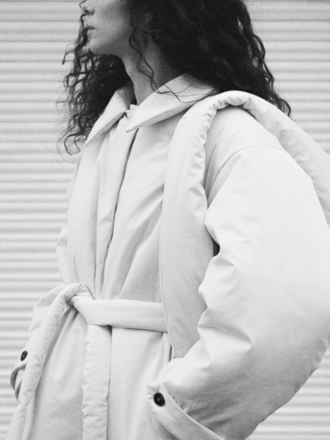 Black to grey Circle padded jacket . Cream