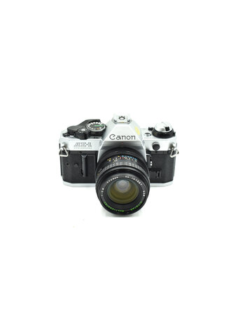 Canon Consign -  Canon AE-1 Pro W/ 28mm F2.8 FD Lens (35mm Film Camera)