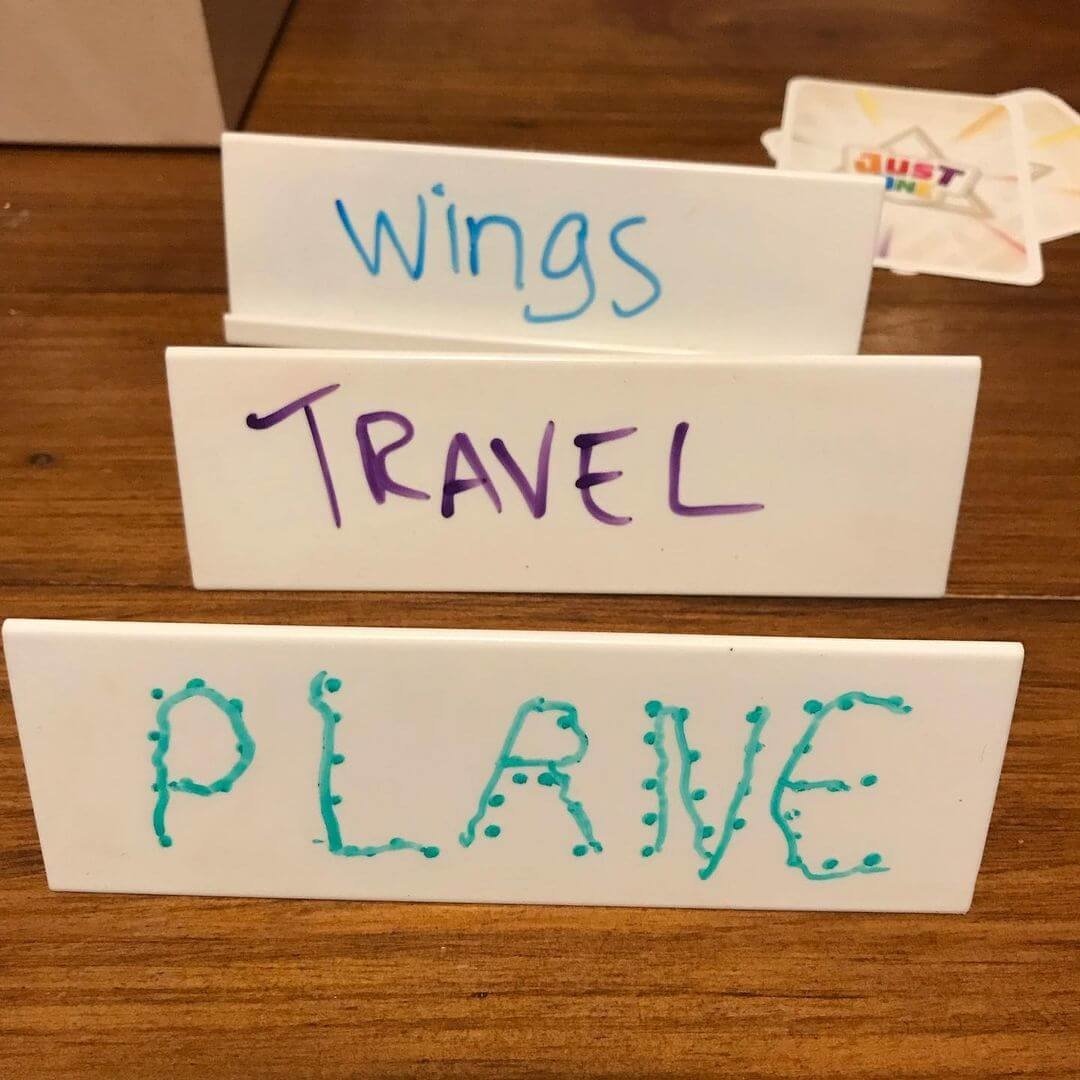 Just One board game being used for kindergarten writing practice