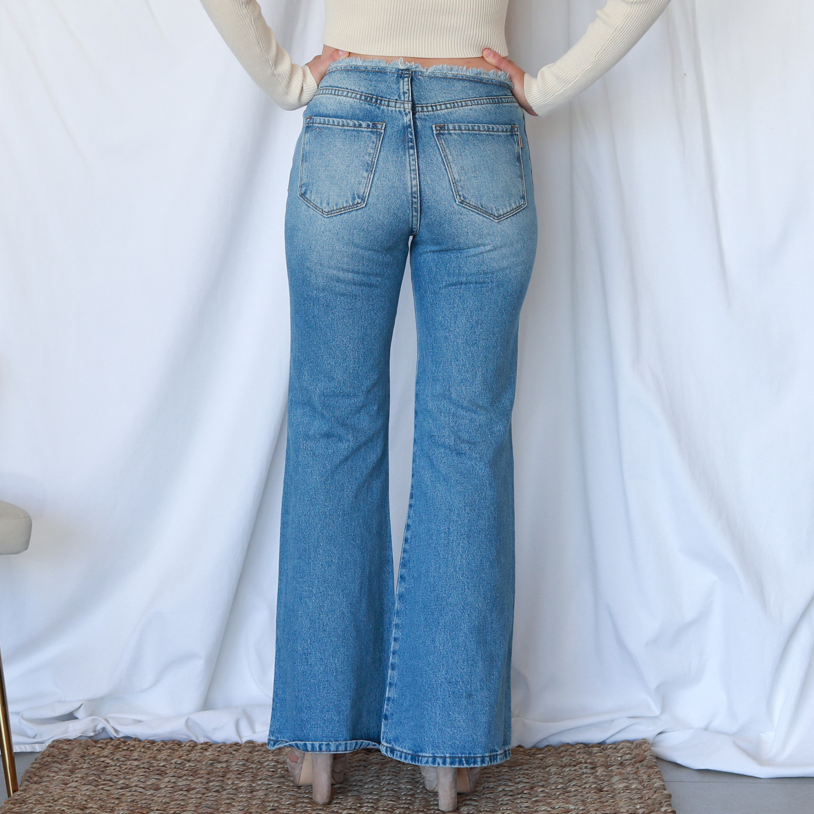 Vi freyed low rise flare jeans