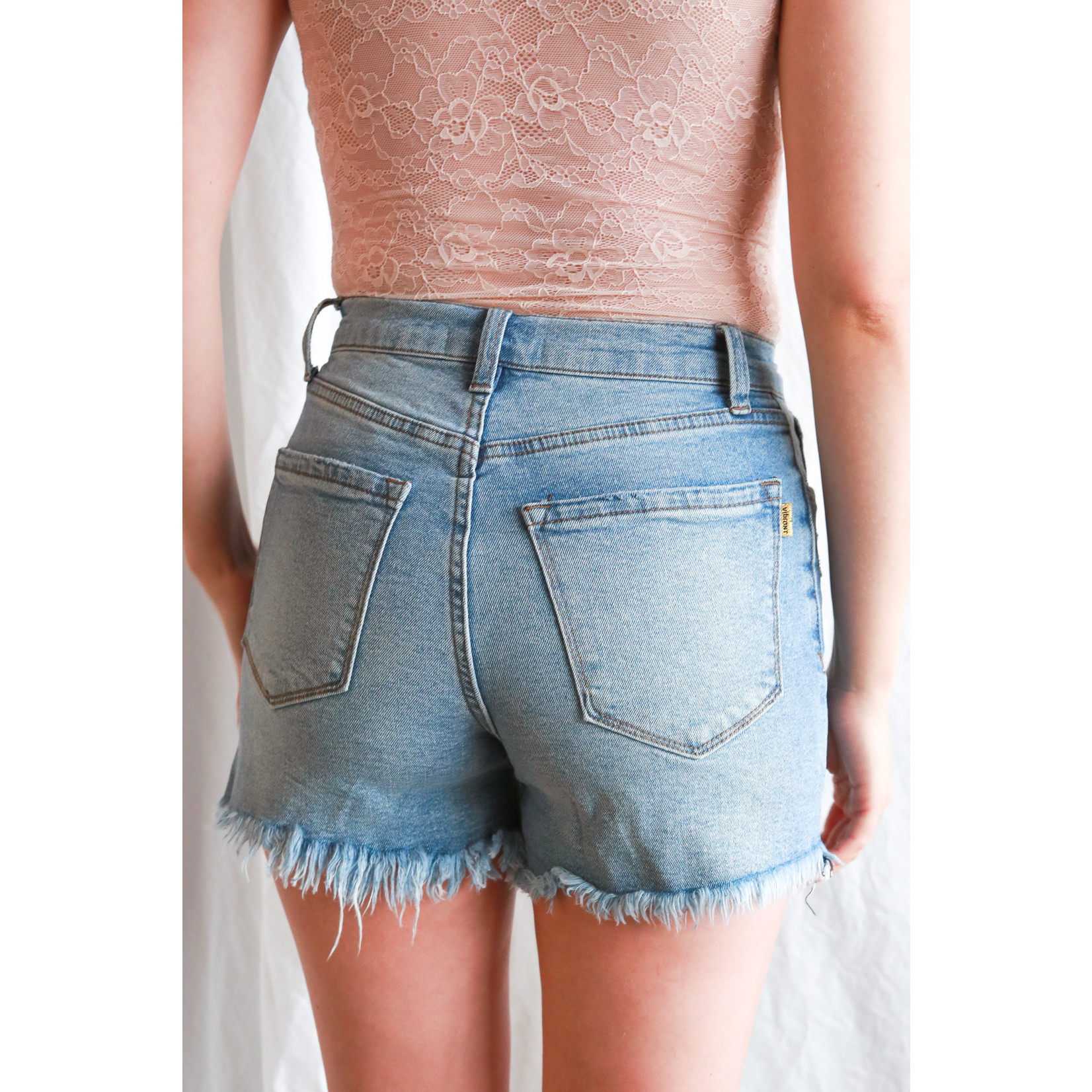 Vee distressed high rise short