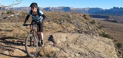 Andrea riding mountain bike in Virgin Utah