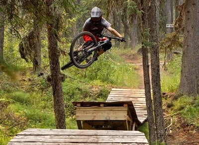 mountain biker doing tabletop jump