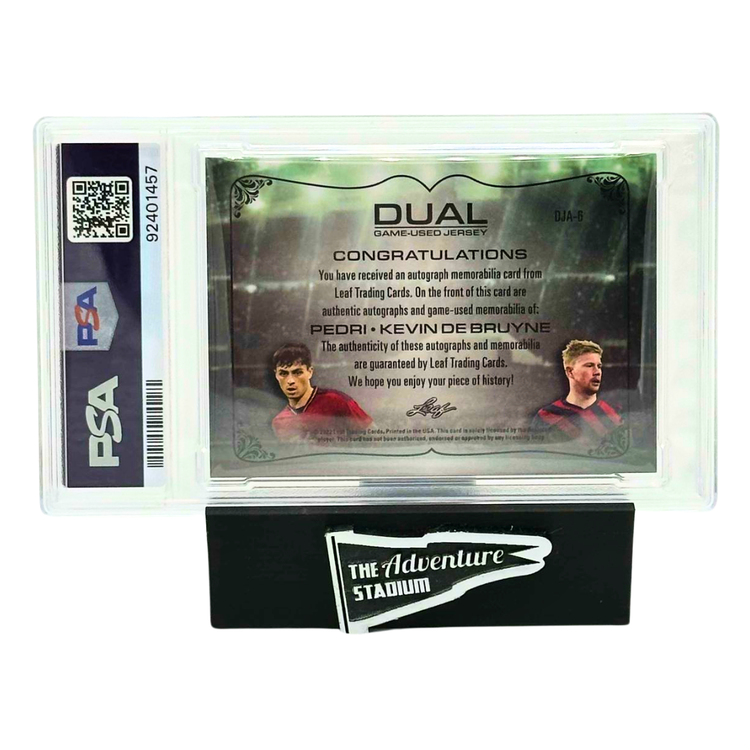 The Adventure Stadium 2022 Leaf Ultimate Soccer K. De Bruyne & Pedri Dual Jersey Auto Gold 1/4 PSA 6