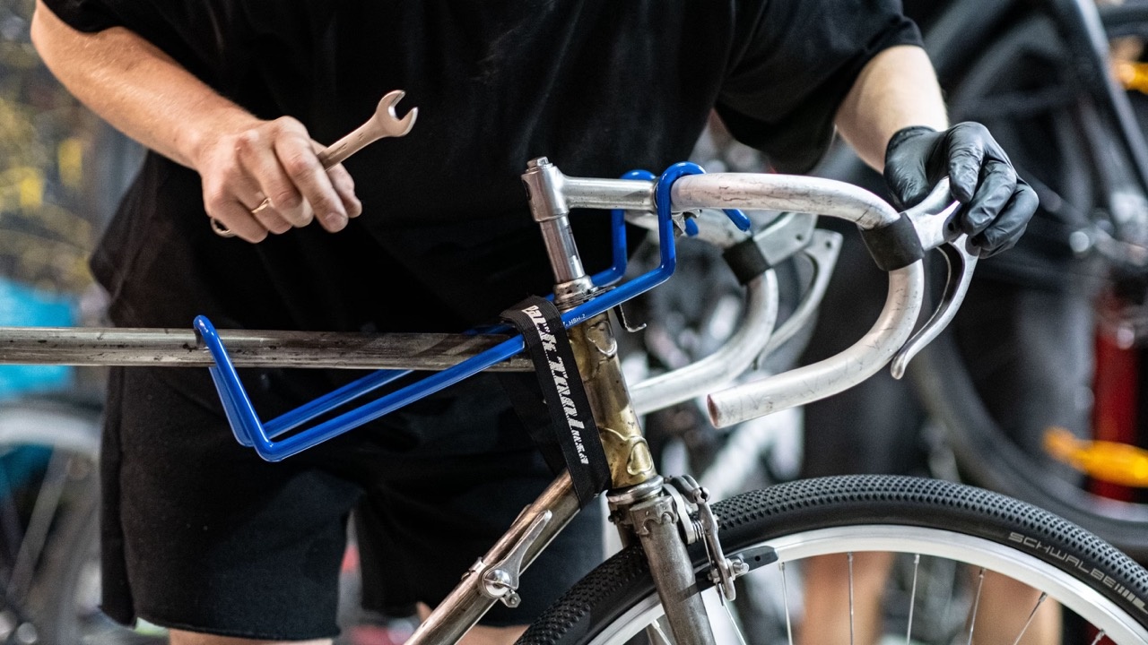 A bike technician working on a bicycle