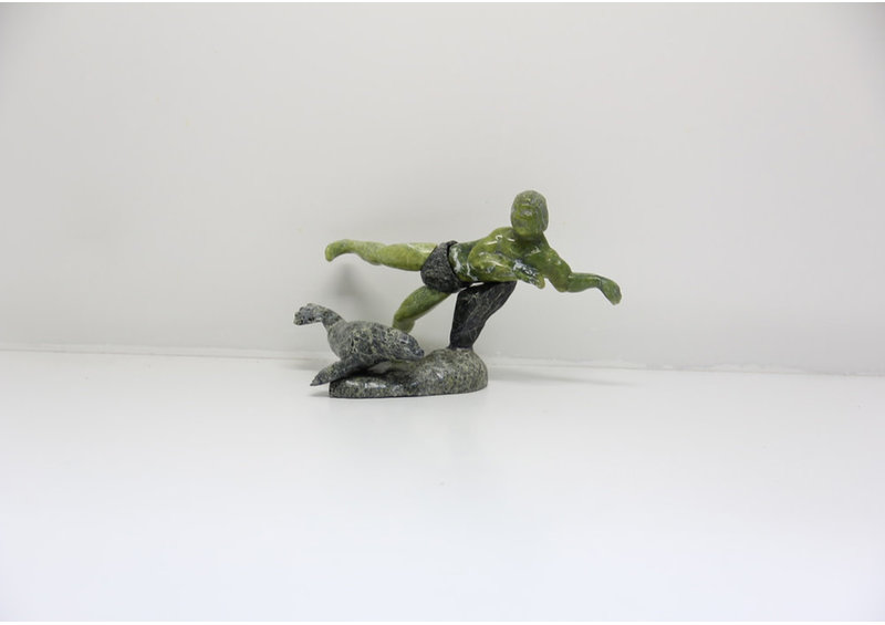 8448 Man swimming with Seal by Isaci Etidloi