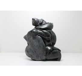 712 Woman skinning by Archie Ishulutak