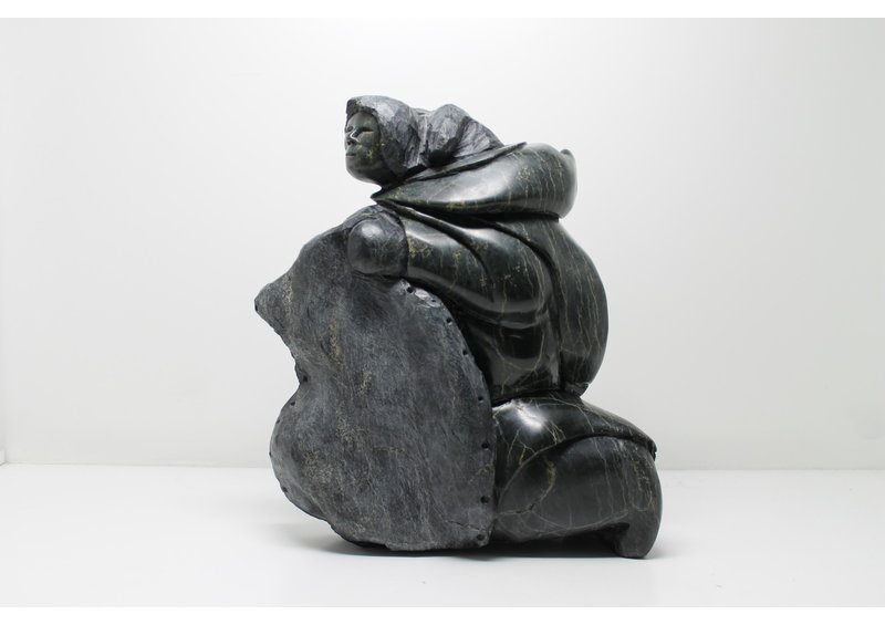 712 Woman skinning by Archie Ishulutak