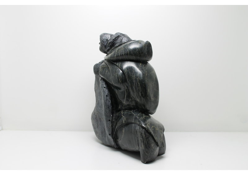 712 Woman skinning by Archie Ishulutak