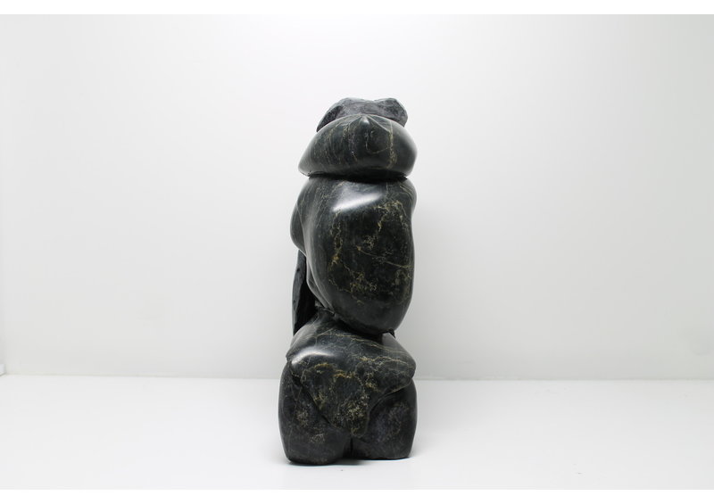 712 Woman skinning by Archie Ishulutak