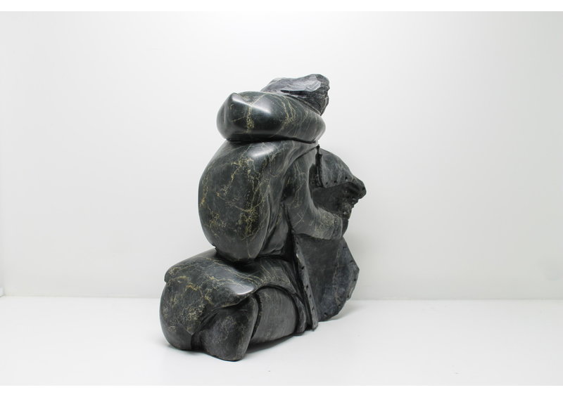 712 Woman skinning by Archie Ishulutak