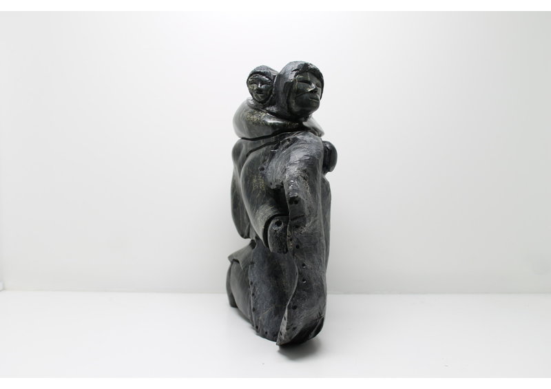 712 Woman skinning by Archie Ishulutak