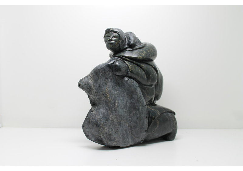 712 Woman skinning by Archie Ishulutak