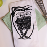 Rockfish Art Studio Lynette Dawson-Summerfeldt Sea Otters Tea Towel, Black