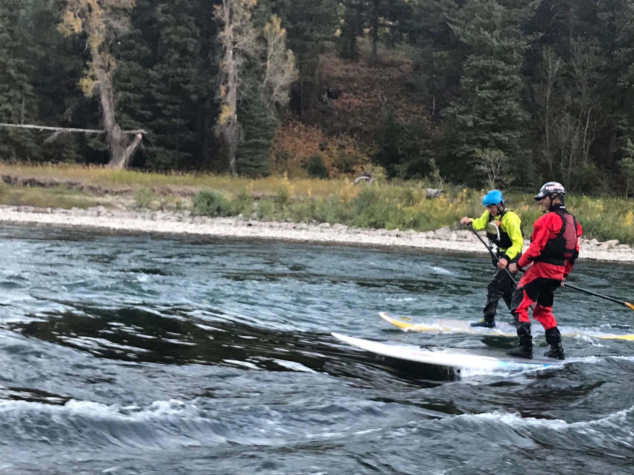 Owner Aaron Pruzan and Employee Porter Bankhead Surfing on the Snake River Jackson, WY