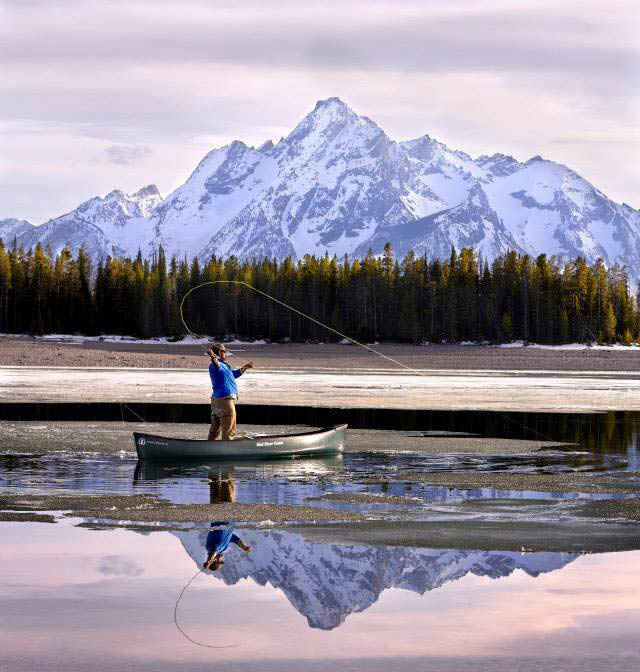 Fishing off a Canoe with Tetons in view