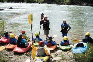 Aaron teaching kids on the river