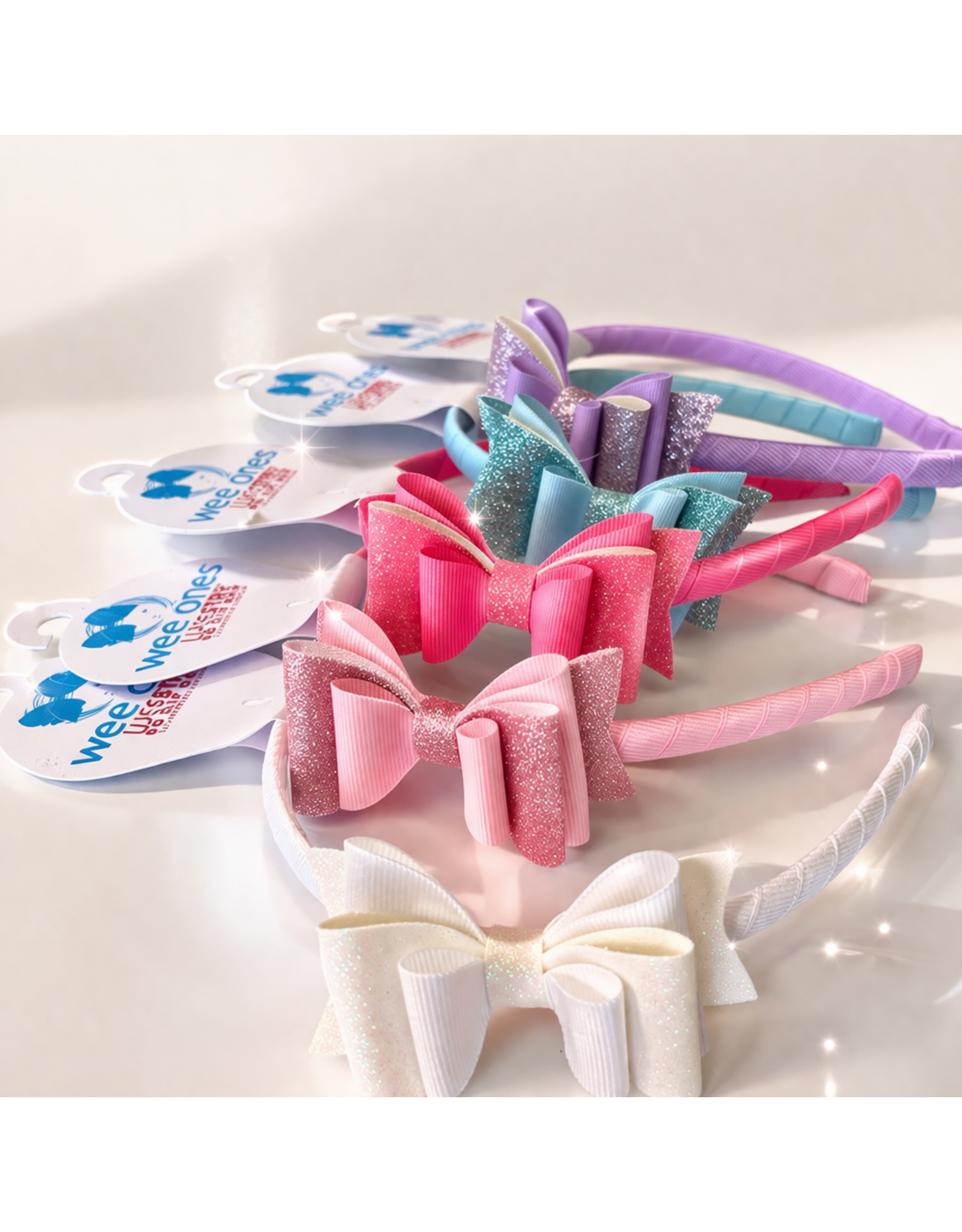 Wee Ones- Med Lay Glitter Vinyl & Grosgrain Bowtie on Wrapped Hdbd