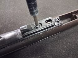 Removing top screws from an MWS bolt carrier group