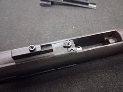 Removing the MWS nozzle spring retention lock