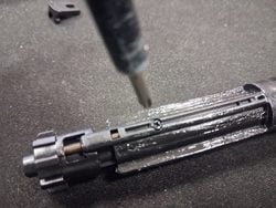 Removing the side screw from the MWS nozzle