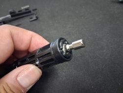 Accessing the piston head on an MWS nozzle assembly