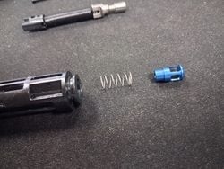 Stacking the MWS nozzle valve and spring for reassembly