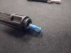 Inserting the Unicorn nozzle power valve and spring into the MWS nozzle
