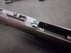 Positioning the MWS nozzle spring retention lock