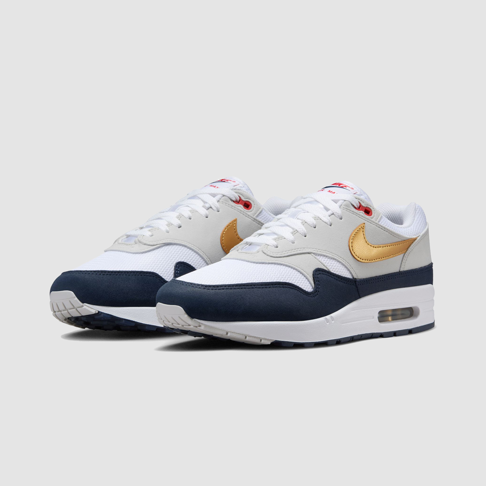 white nike air max with gold tick