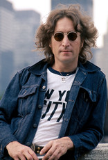 Gruen John Lennon wearing NYC T-shirt and denim jacket on roof in NYC 1974 by Bob Gruen