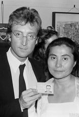 Gruen John Lennon with his green card and Yoko Ono, NYC 1976 by Bob Gruen