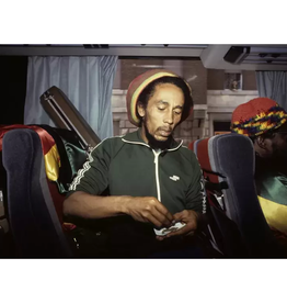 Goldsmith Bob Marley Roll Joint on Bus, 1980 by Lynn Goldsmith