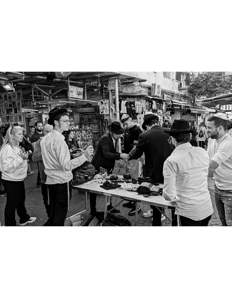 יִשַׁי Men Wrapping Tefillin, Carmel Market, Israel, Dec 2023 by יִשַׁי