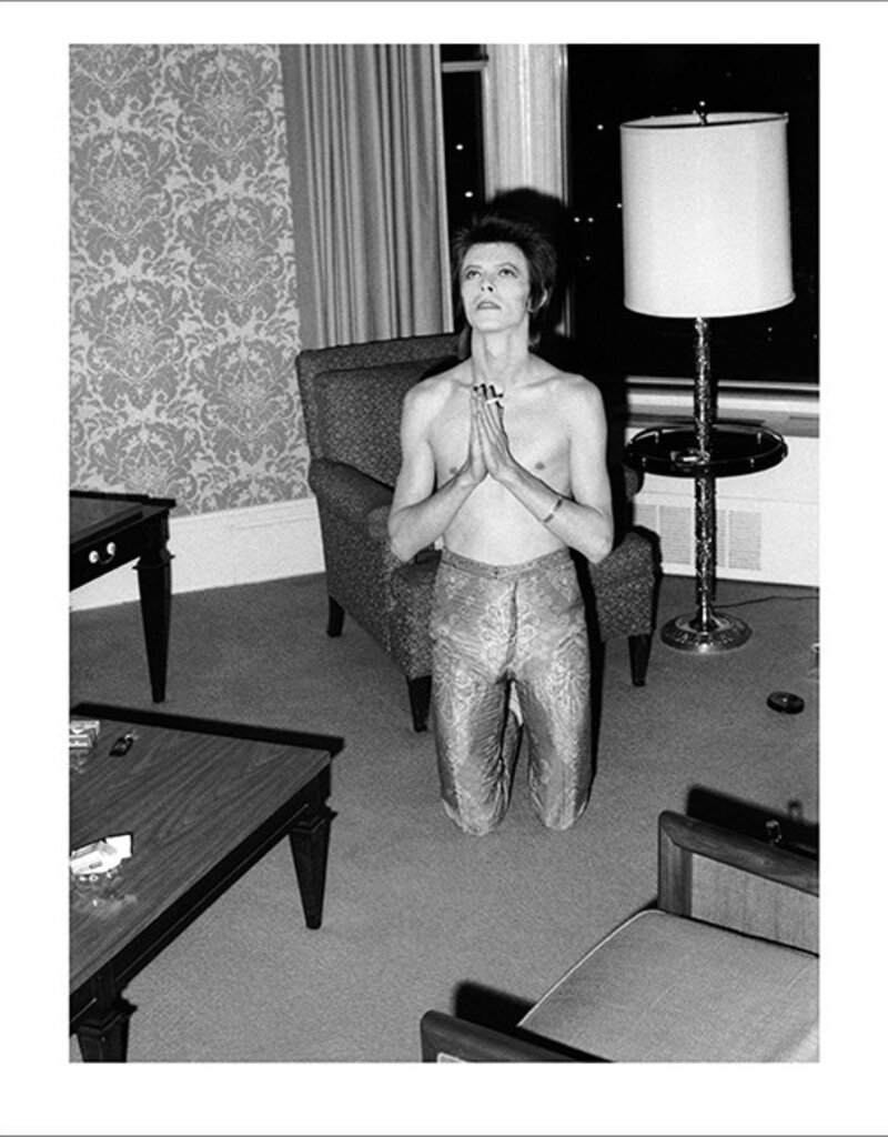Rock Bowie Praying on Knees, Chicago 1972  by Mick Rock