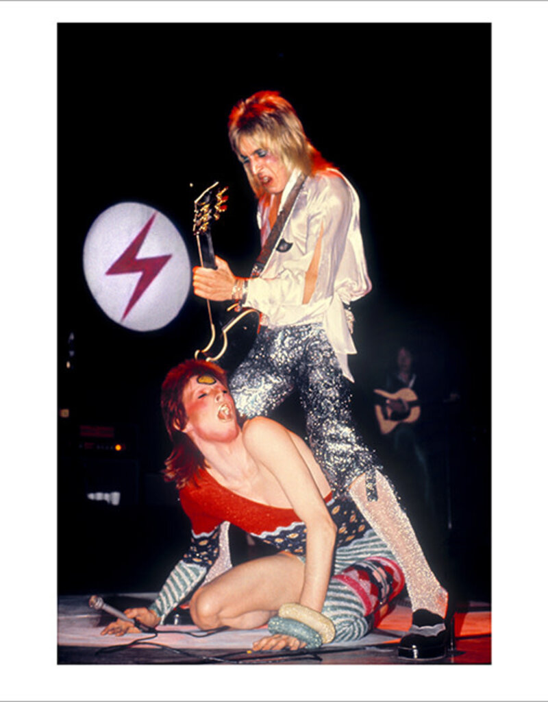 Rock Ronson Straddling Bowie, UK 1973 by Mick Rock
