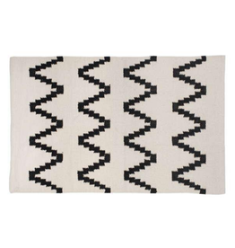 Tapis beige à motifs noir